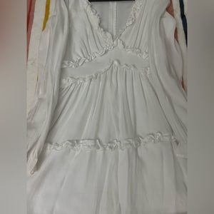 White long sleeve dress with V neck.